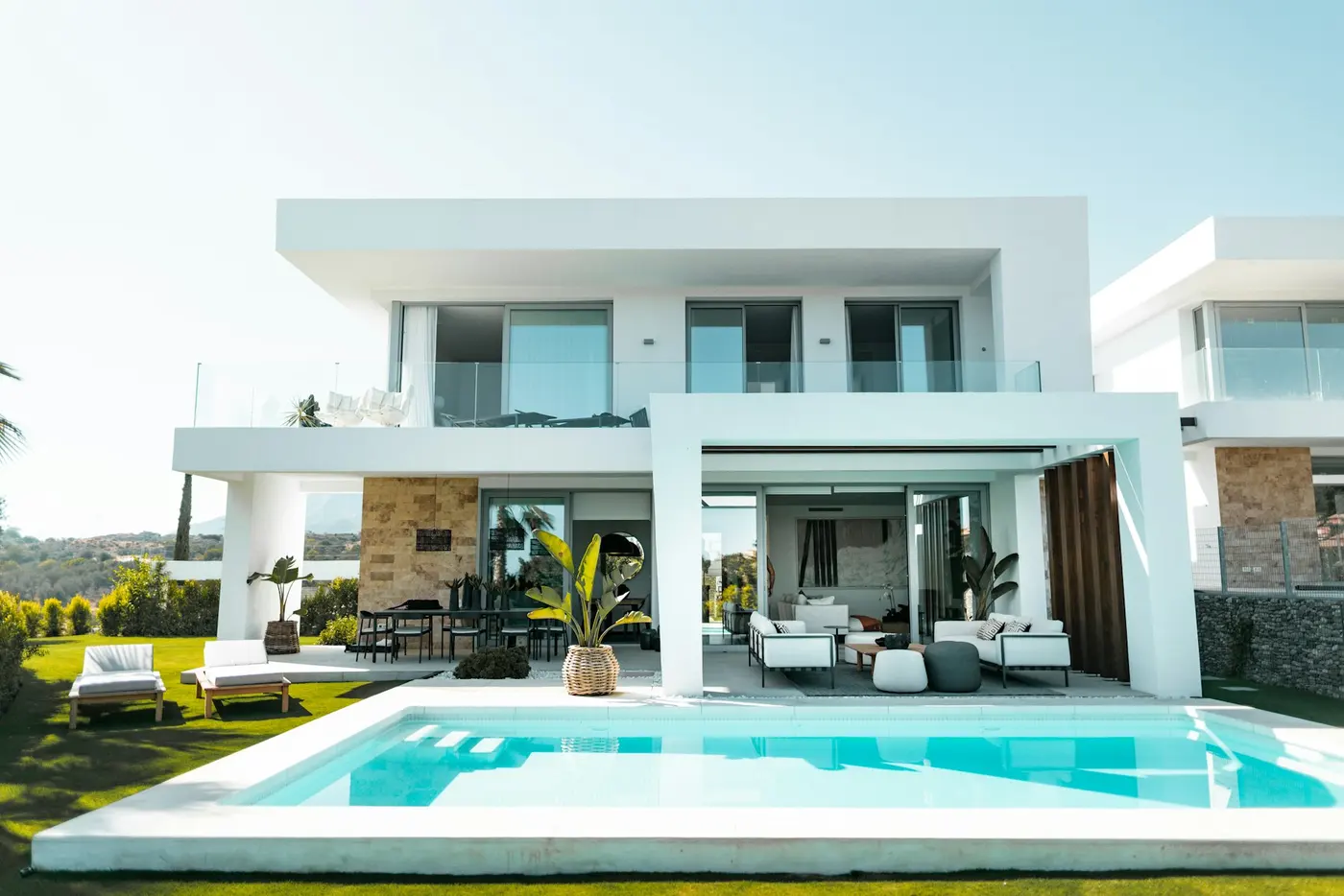 A sunlit villa with a swimming pool